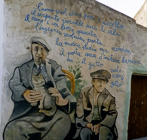 Immagine con murales, gatto, scritta, due, murale, muro, porta, persone, uomini, disegno